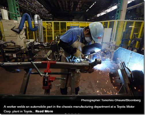 A worker welds an automobile part in the chassis manufacturing department at a Toyota Motor Corp. plant in Toyota City.